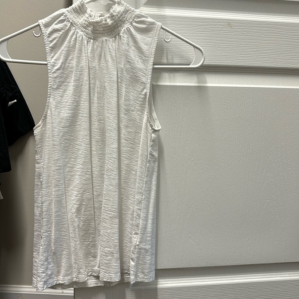 Nation, LTD sleeveless white tee with decorative snaps and smocked neck.